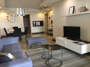 Living room. More than 100 international TV channels for you to choose from. 