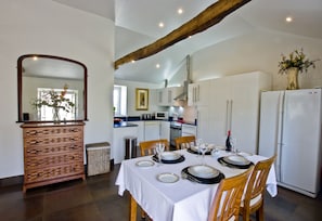 Dining area with four place settings.