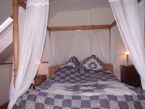 The master bedroom with four-posted bed