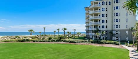 Looking across The Ritz-Carlton lawn to our oceanfront condo. A pathway connects