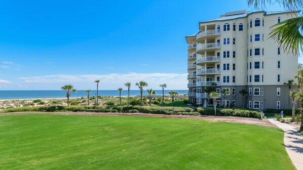 Looking across The Ritz-Carlton lawn to our oceanfront condo. A pathway connects