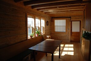 Large dining area with room for 8 to sit comfortably. Historic log dining room.