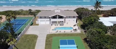 Aerial view East with Pickleball court, Pool and Spa