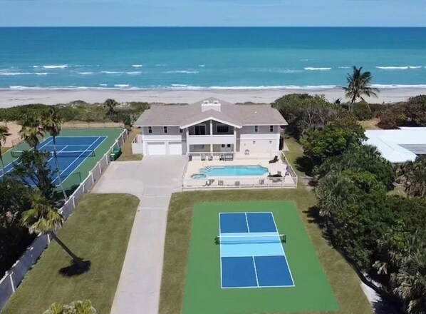 Aerial view East with Pickleball court, Pool and Spa