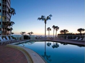 Beachside pool at dusk. OOOH, the picture almost says it all. What day is it? Pass the magic lantern please. I want to turn the clock back.