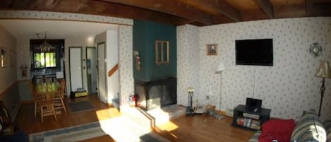 looking into living room from the deck.  The dining room and kitchen are behind