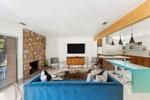 Living room with fireplace and smart TV. 