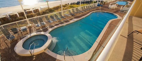 Yes, this can be YOUR vacation view!  Sundeck and Two Pools with hot tubs, one on each side of the building.