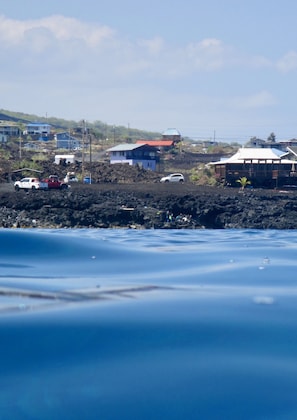 Looking back at the house from the rock, the local snorkel spot