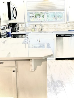 Kitchen has all major appliances and quartz countertops 