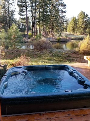 Hot Tub off  back deck and master bedroom with view of pond and 16 & 17th hole.