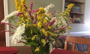 A fresh bouquet of meadow flowers greets guests when in season.