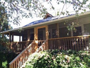 Catch late afternoon rays of sun on the screened porch.