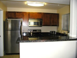 kitchen opens to the family rom