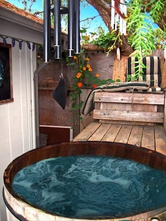 Take a soak in the bubbling cedar wood hot tub