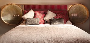 Headboard at the master bedroom. Bed side tables done with antique sieves