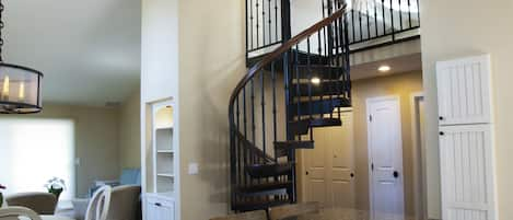 Living area with staircase going to loft.