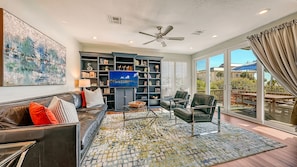 living room with a large breakfast patio and beach views