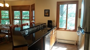 The kitchen has been updated with quartz counter tops, and new appliances.