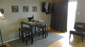 49" 4k tv, DVD Player, and Counter Height table for 4