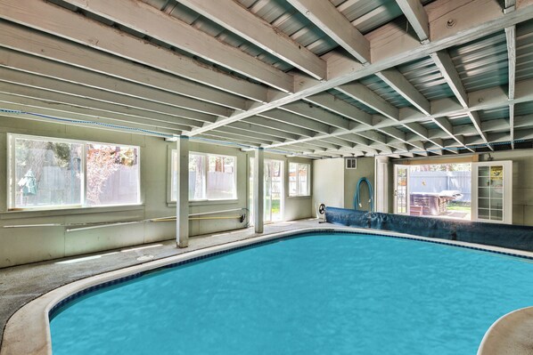 Summertime heated pool step down into and enjoy a small deep oasis.