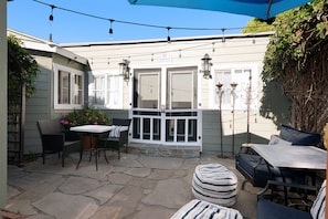 Private sunny courtyard for lounging, dining & BBQ. Lighting for magical nights.