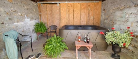 Sheltered outdoor hot tub, just steps from the back door.  Soak your cares away.