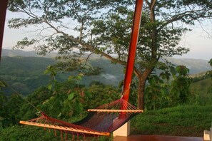 Relax on the back patio surrounded by nature.
