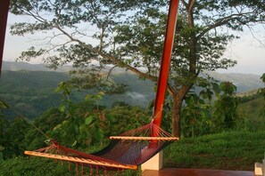 Relax on the back patio surrounded by nature.