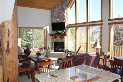 Main floor family room w/ fireplace and vaulted ceiling; unobstructed views