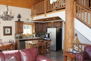 Fully equipped kitchen with stainless steel appliances and granite countertops