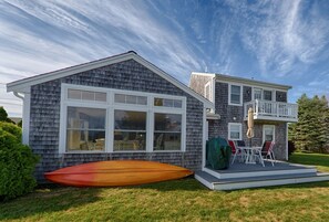 Outdoor fun with tandem kayak and gas grill (life preserves included).