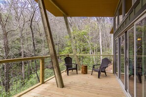 Each cabin features expansive covered back deck.