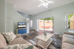 Living room with two comfortable couches, cable tv and streaming