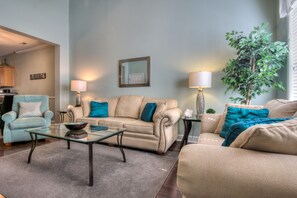 Neutral beachy colors and hardwood floors throughout first floor