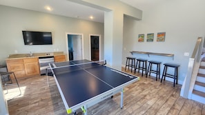 Rec room with ping pong, seating, and satellite TV
