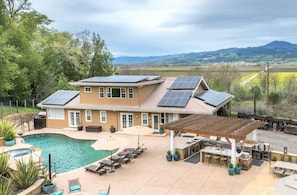 Your own resort backyard with pool, hot tub, outdoor kitchen and vineyard views.