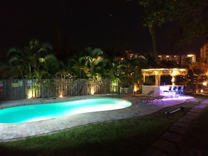 Pool at night with new tiki hut/tiki bar