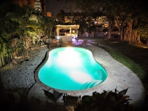 Pool at night with new tiki hut/tiki bar