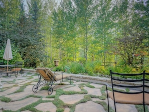 Enjoy the whistling green aspen trees and the bubbling fountain in the garden