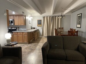 Living space opens into dining and kitchen area.