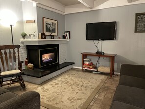 Living room area with gas fireplace.