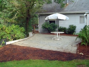 New Stone patio is great for outdoor meals or firepit gatherings.