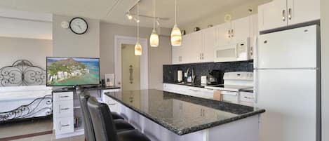 Full Kitchen with Granite Center Piece