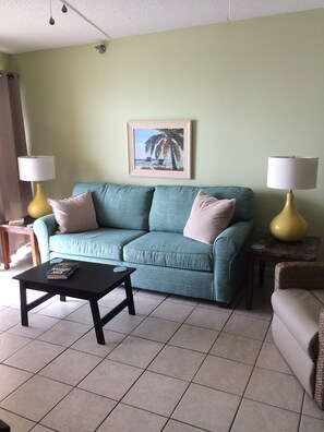 Living room with sleeper sofa and recliner.