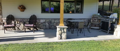 Patio overlooks pond, complete with barbecue