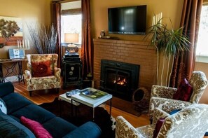 Living Room with Directv and warmth of a fire on cool mornings.