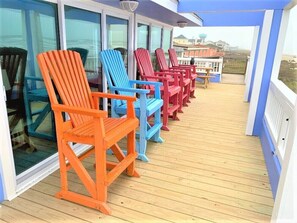 Brand new deck with lots of colorful chairs to sit in!