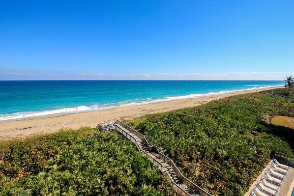 Enjoy watching and listening to the waves from your private balcony