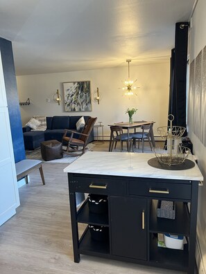 Kitchen island with drawers that open both ways. Lots of work and serving area.